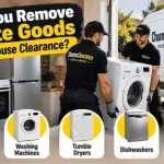 House clearance team removing a washing machine and fridge from a property