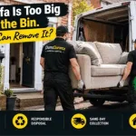 Professional team removing an old sofa from a house